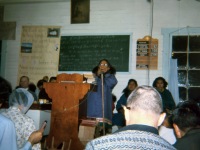 1960s Mary Curtis playing harmonica. Cora Cleveland on far right, Harold Beck on left, both facing audience