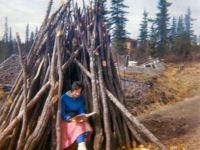 Late 1960s Dorene studying in woodpile.
