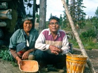 Olive and Mark Cleveland, Ambler Village residents displaying handcrafted birchbark baskets.  Ambler Alaska, 1964