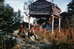 Gale and Rodney Tickett in front of Maude Cleveland's cache, Ambler, Alaska.