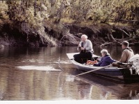 photo from Heidi, Oliver with ?? in small river boat with outboard motor