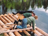 Oliver Cameron and Heidi building raft, Norway